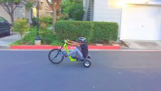 Gavin trying to drift on my Big Wheel Razor