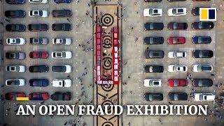 Chinese police showcase anti-fraud effort with US$10 million display of cars and cash